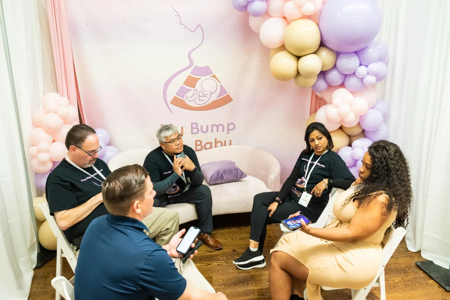 Charlotte speaking with expectant families at a My Bump My Baby community event