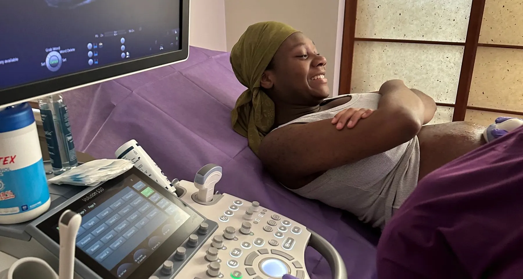 A sonographer performing an ultrasound scan in the My Bump My Baby studio